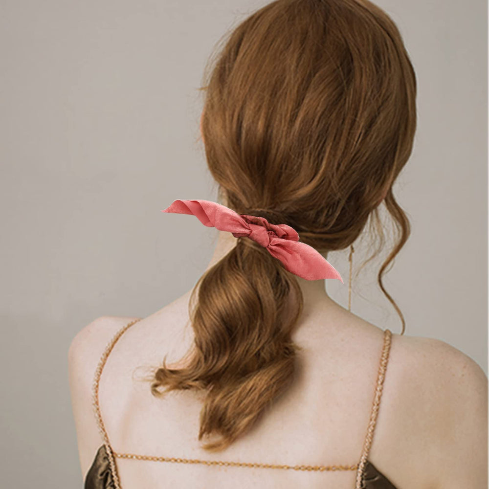 ACO-UINT removable bow detail close-up showing versatile styling option