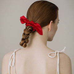 ACO-UINT scrunchie on bun showing size and secure non-kinking hold