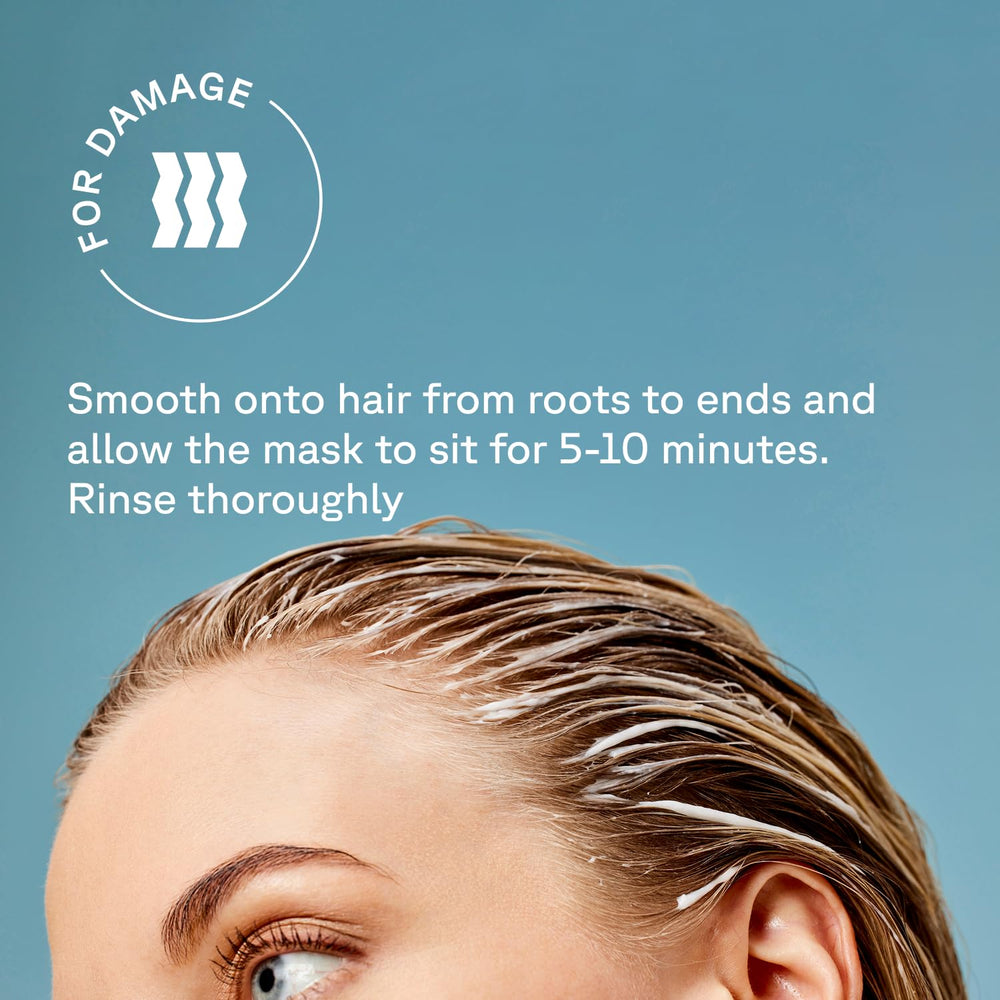 Acure Bonding Hair Mask next to a measuring cup showing 5 fl oz scale benefit