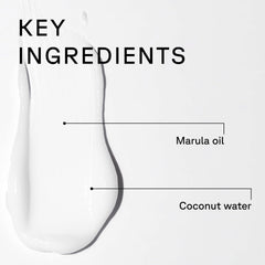 Acure conditioner applied to wet hair in shower for detangling and hydration benefit