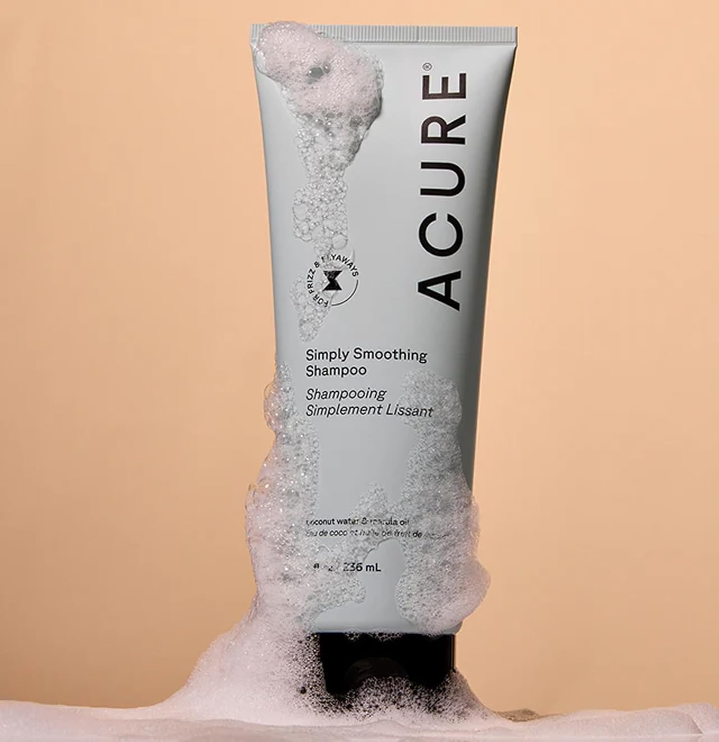 Acure shampoo texture on hand showing lightweight lather and moisture