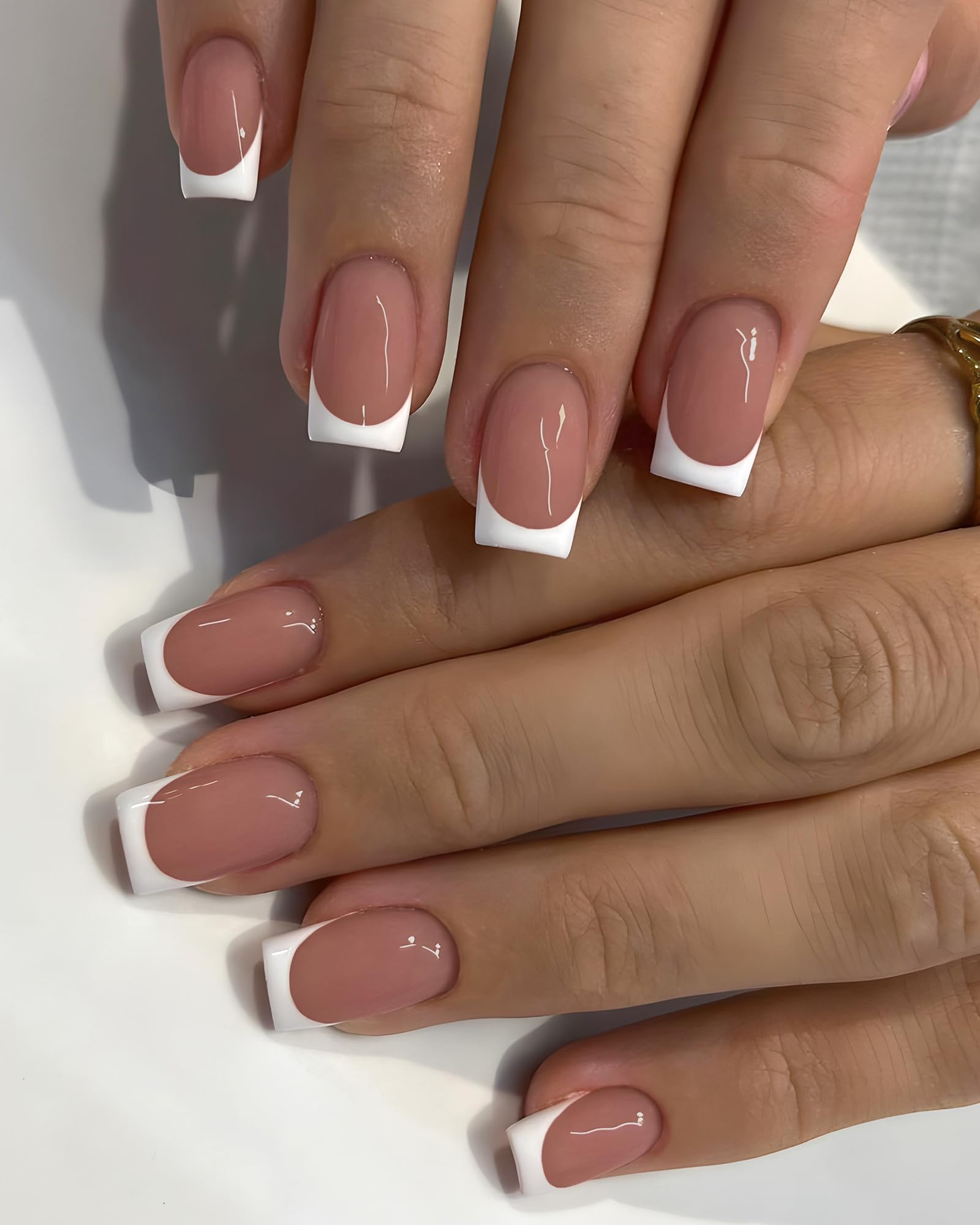 AddFavor finished short square French manicure on model hand showing elegant everyday style benefit