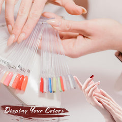 ADULLPONY hand holding the swatch collection to show scale and salon portability benefit