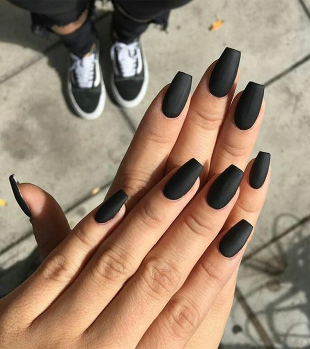 Aegenacess finished manicure close-up showing even matte coverage and refined coffin tips