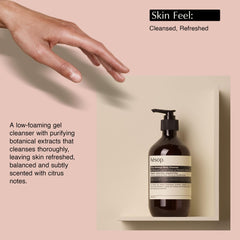 Aesop bottle on shower shelf in use showing refreshing daily routine