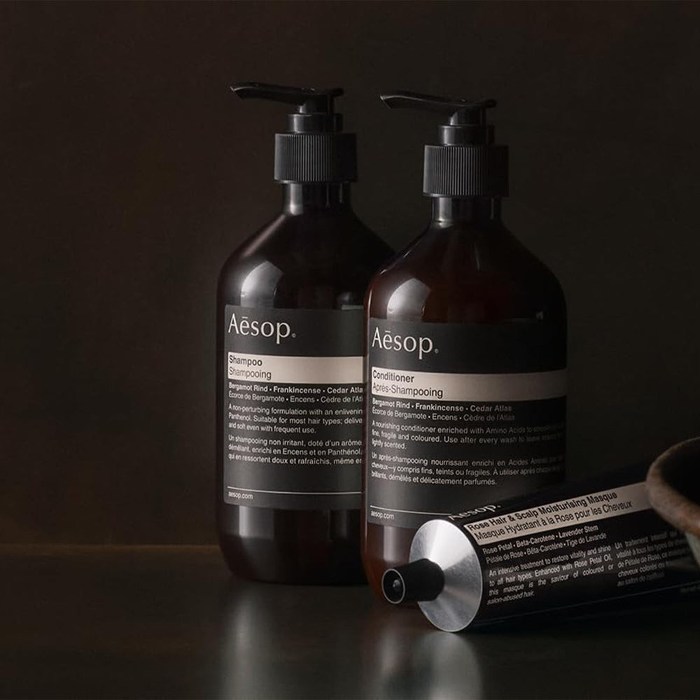 Aesop conditioner applied to hair lengths and ends for detangling benefit