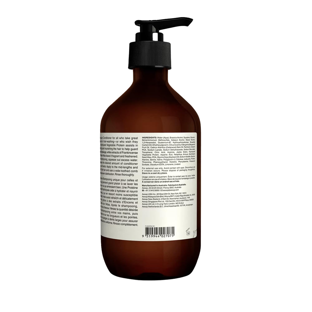 Aesop conditioner on bathroom shelf in lifestyle scene conveying refinement