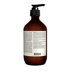 Aesop conditioner on bathroom shelf in lifestyle scene conveying refinement