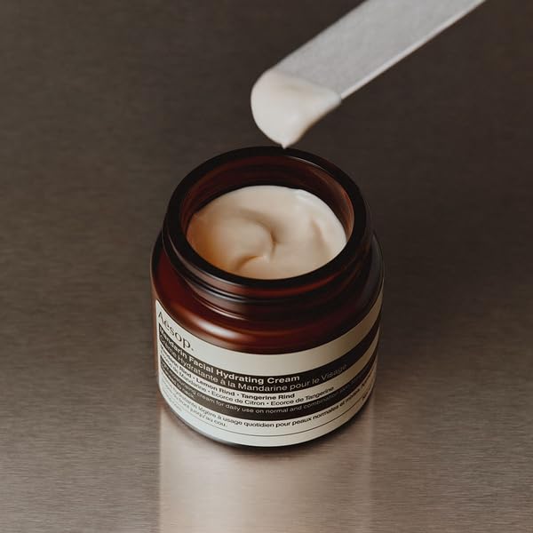 Aesop mandarin cream layered under sunscreen illustrating compatibility and smooth layering