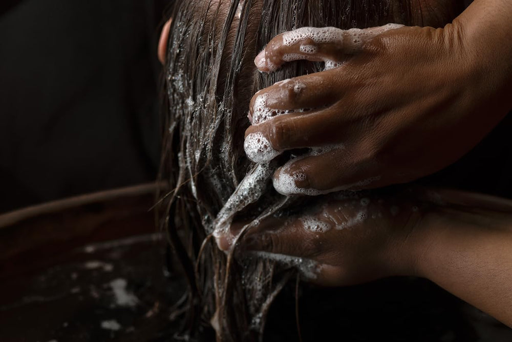 Aesop bottle in shower scene illustrating in-use cleansing experience