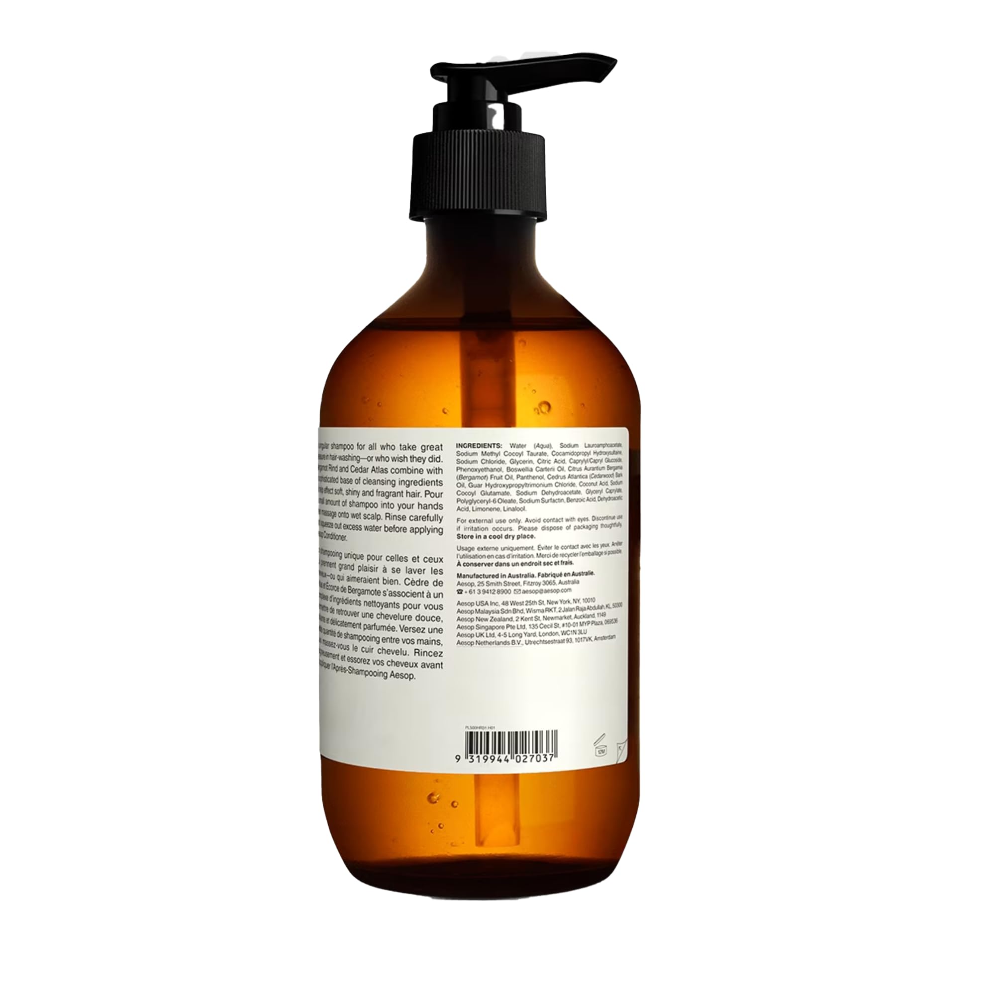 Aesop 16.9 oz bottle next to hand for clear size and scale