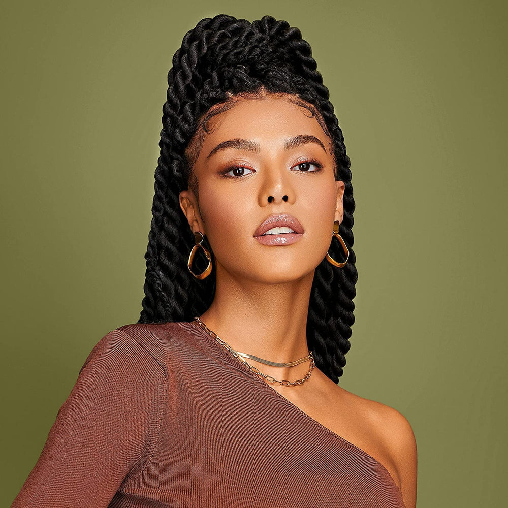 African Pride applying product to wet hair for smoother detangling