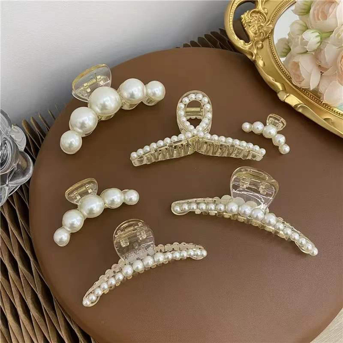 Agirlvct front view of six pearl clips showing variety and gift-ready presentation