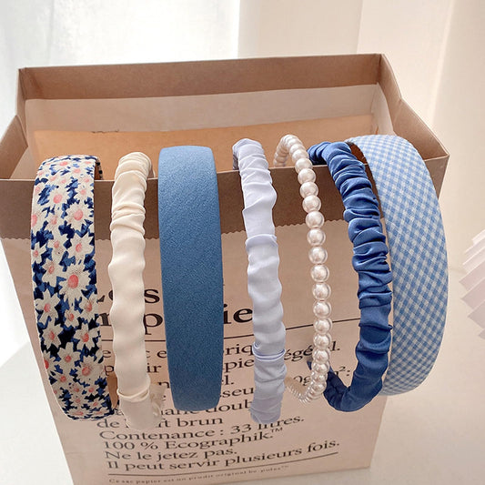 Agirlvct front packaging showing seven blue headbands and gift-ready appeal
