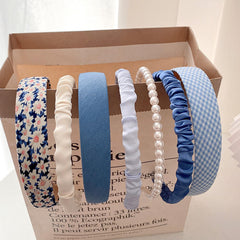 Agirlvct front packaging showing seven blue headbands and gift-ready appeal