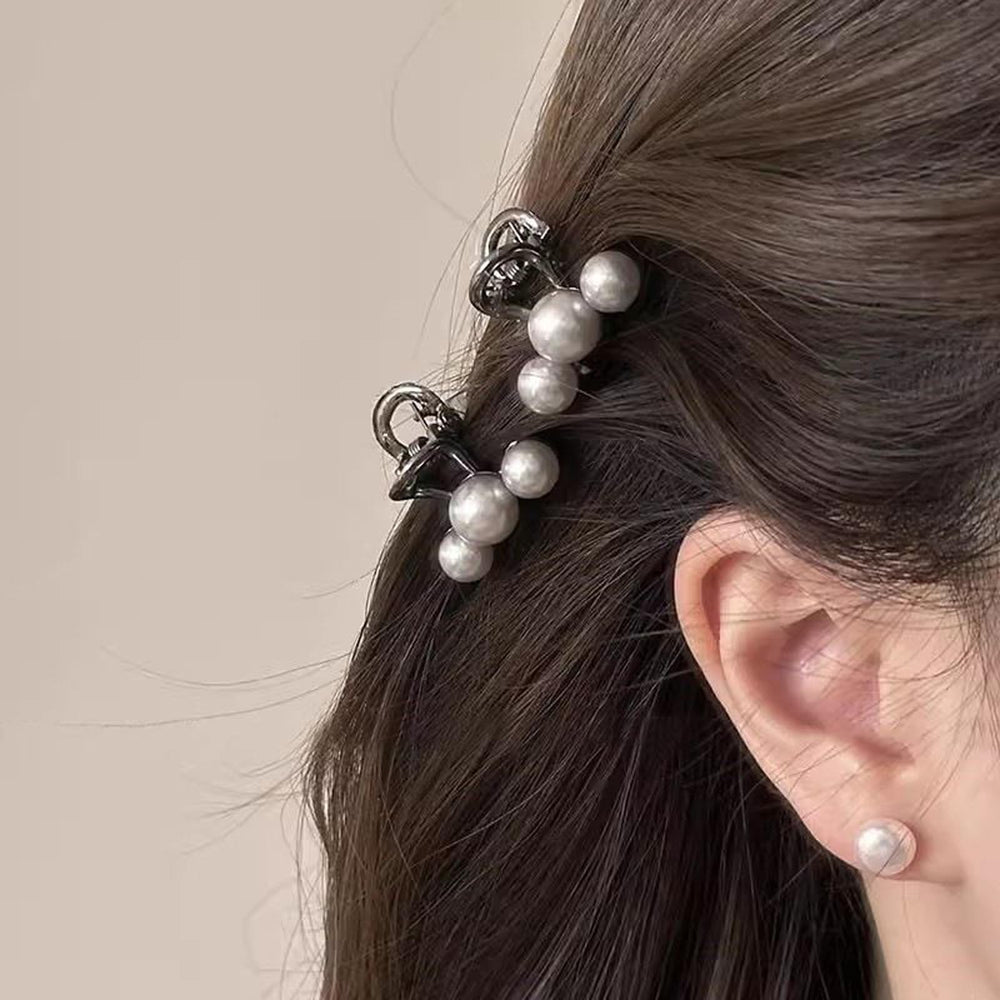 Agirlvct clip used in a half-up bun hairstyle, secures hair stylishly
