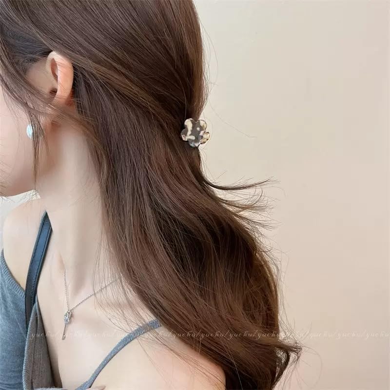 Agirlvct lifestyle shot of woman wearing clips outdoors, effortless accessory benefit