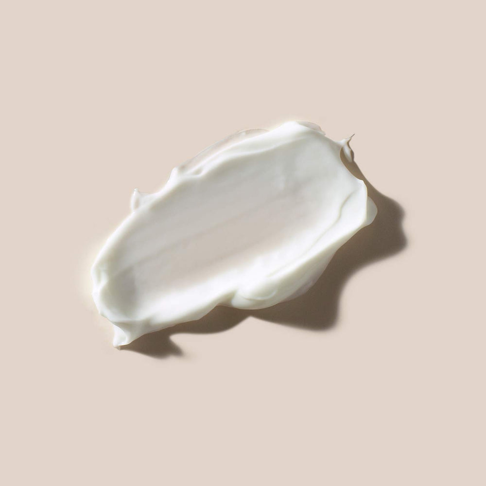 AHAVA cream being smoothed on cheek demonstrating nourishing application and comfort