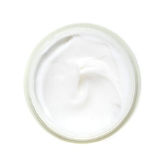 AHAVA cream held in hand to show 1.7 fl oz scale and portability benefit
