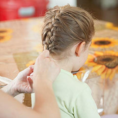 AHIER stylist using clear elastics in a salon for precise, neat styling