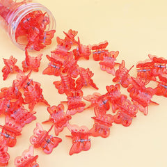 AHONEY festival look with multiple red clips scattered for playful Y2K style