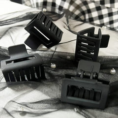 AHONEY clips stored in travel pouch illustrating convenience for on-the-go styling