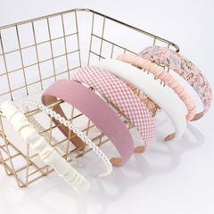 AHONEY headbands next to ruler to show stretch and universal size fit