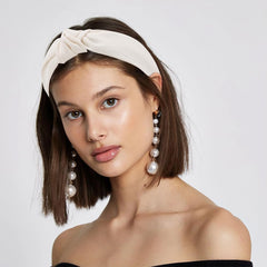AHONEY flatlay of five headbands demonstrating mix of neutral styles