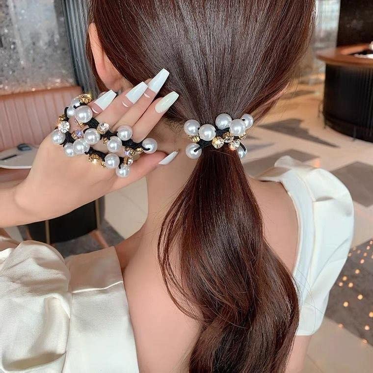 AHONEY bridal hairstyle showcasing pearl ties adding refined, photo-ready accent