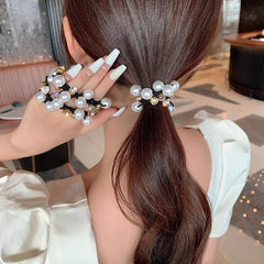 AHONEY bridal hairstyle showcasing pearl ties adding refined, photo-ready accent