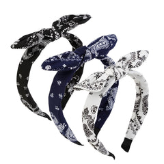 AIBFRID front view of three paisley bow headbands in black white navy, versatile accessory