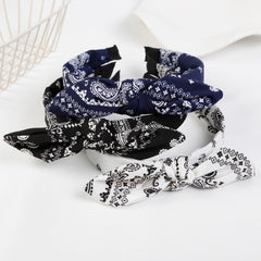 AIBFRID lifestyle shot at outdoor concert with headband completing a boho outfit