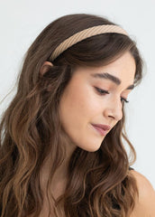 AIBFRID headband next to hand showing scale and lightweight portability