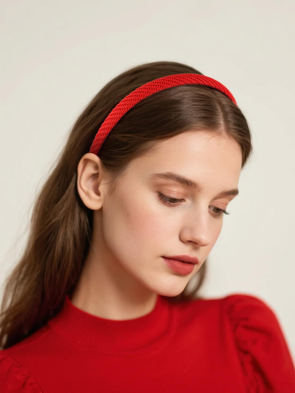 AIBFRID headband held in hand to show thin size and scale