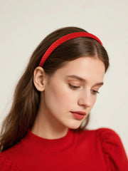 AIBFRID headband held in hand to show thin size and scale