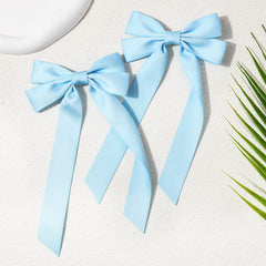 Aileam bow clipped to headband showing versatile styling option