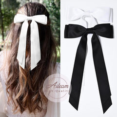 Aileam bow clipped on ponytail demonstrating easy styling and neat finish
