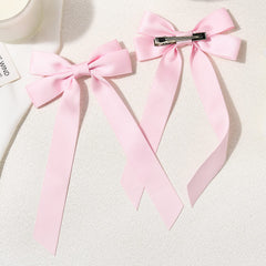 Aileam bows attached to headband offering styling versatility