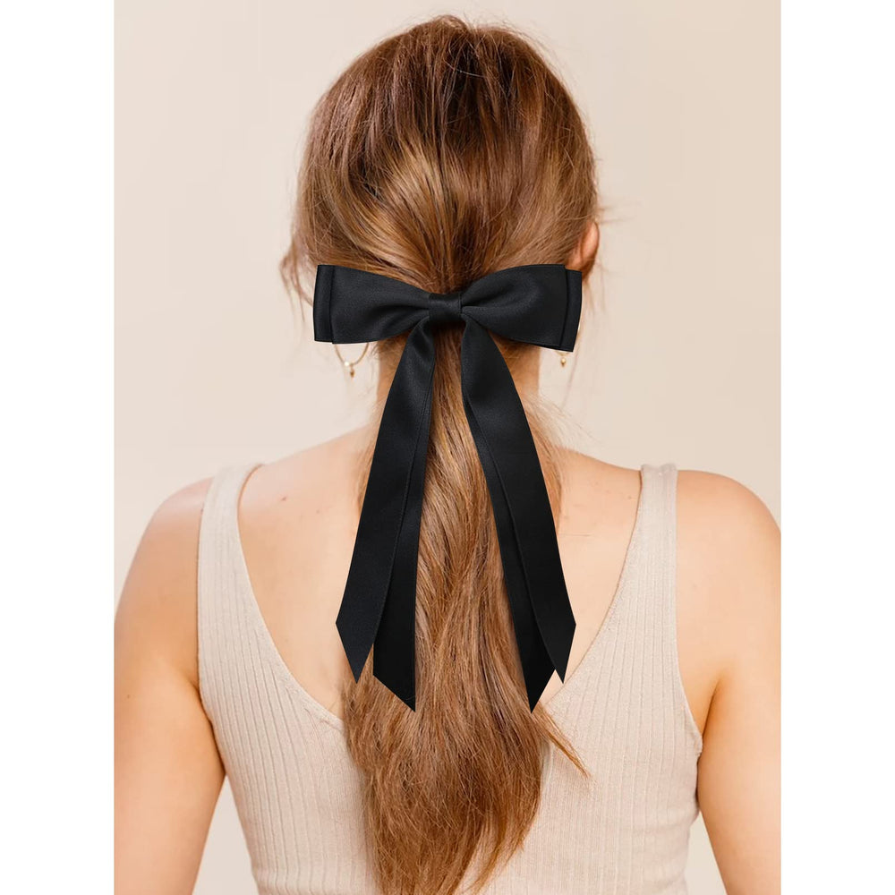 Aileam child wearing bow in outfit showing charming look and event-ready style