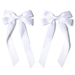 Aileam bow in lifestyle setting on girl at event adding refined charm to outfit