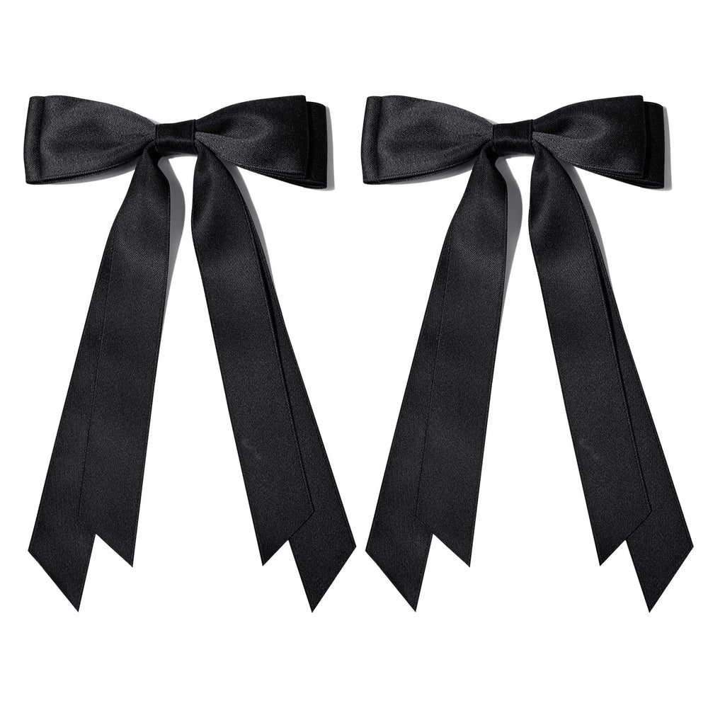 Aileam bow beside ruler showing 5.2 by 8 inch size for scale and proportion