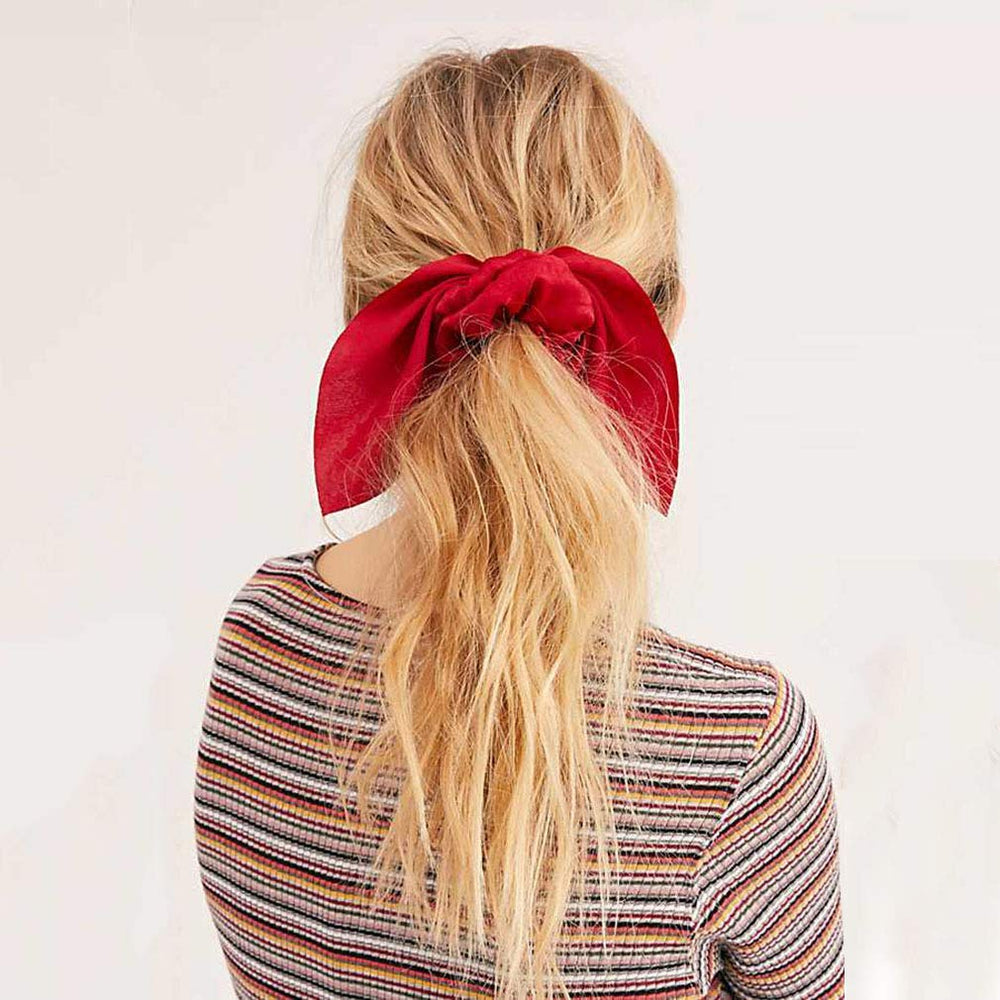 Aileam scrunchie worn on wrist as accessory illustrating versatile styling