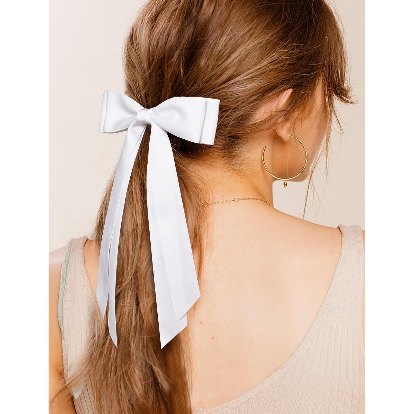 Aileam bow held in hand showing scale and lightweight comfortable fit benefit