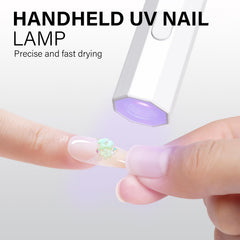 AILLSA mini UV next to polish bottles showing how it integrates into a manicure kit