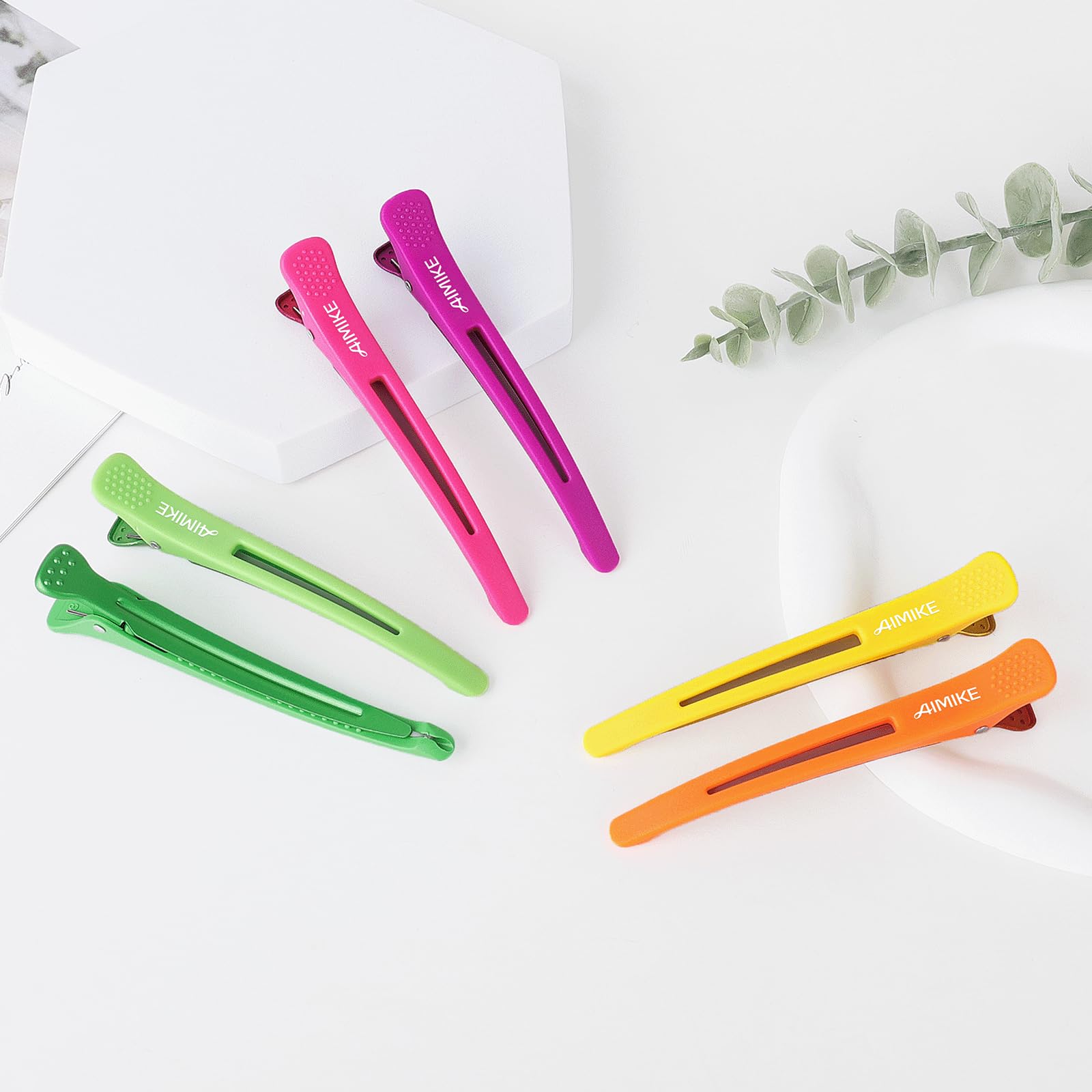 AIMIKE clips arranged on bathroom counter showing everyday use and vibrant colors benefit