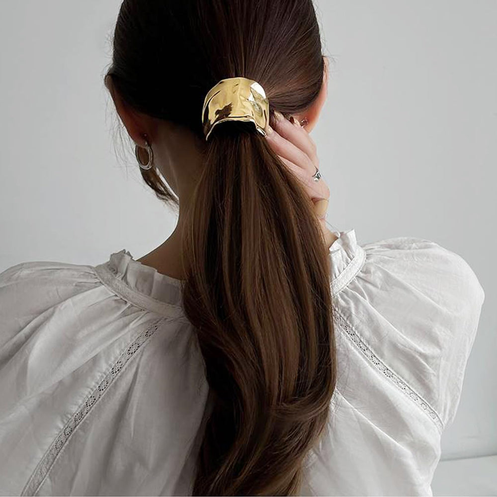 Ainvhh cuff on a low ponytail demonstrating elegant concealed elastic benefit