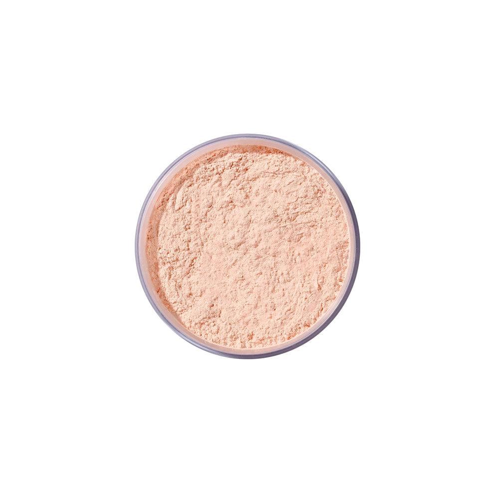 Airspun swatched on hand demonstrating honey beige coverage and blur