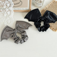 AIUPUOC scrunchie in Halloween party setting adding spooky style to an outfit