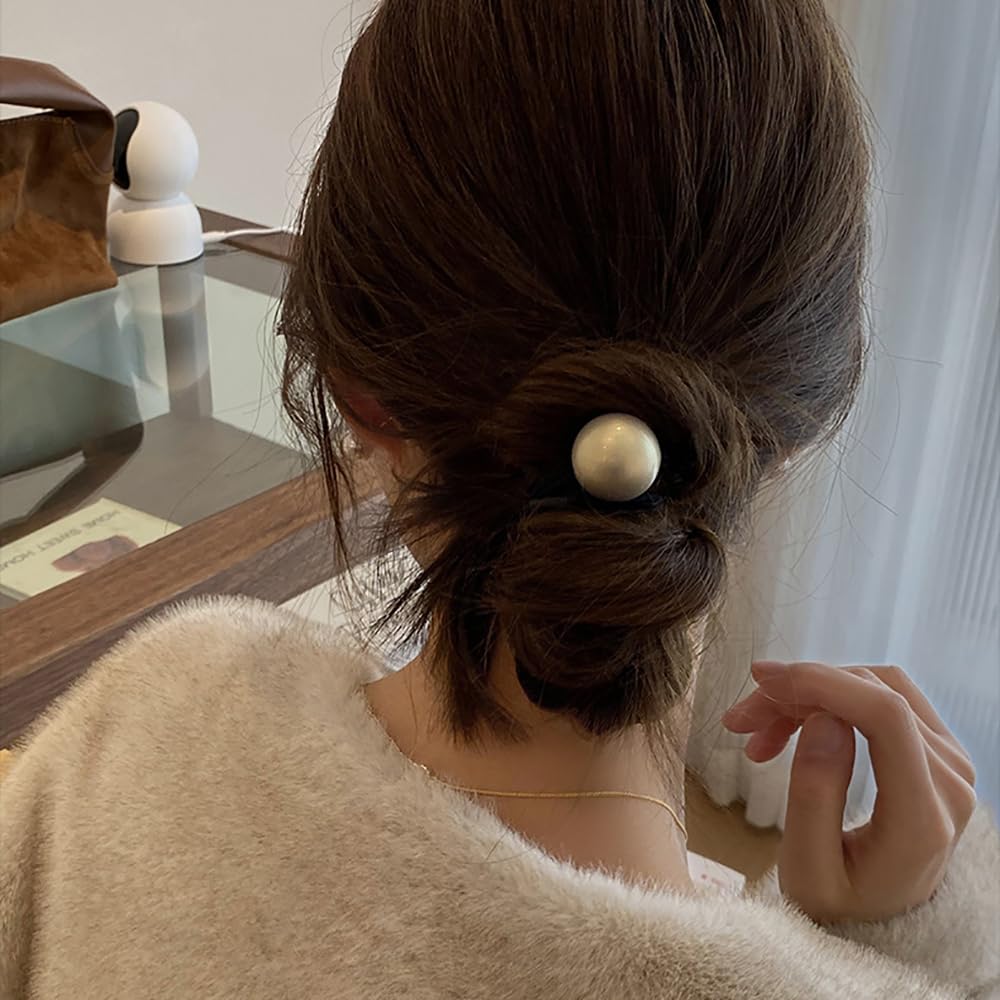AIUPUOC bun hairstyle with pearl accent adding refined flair