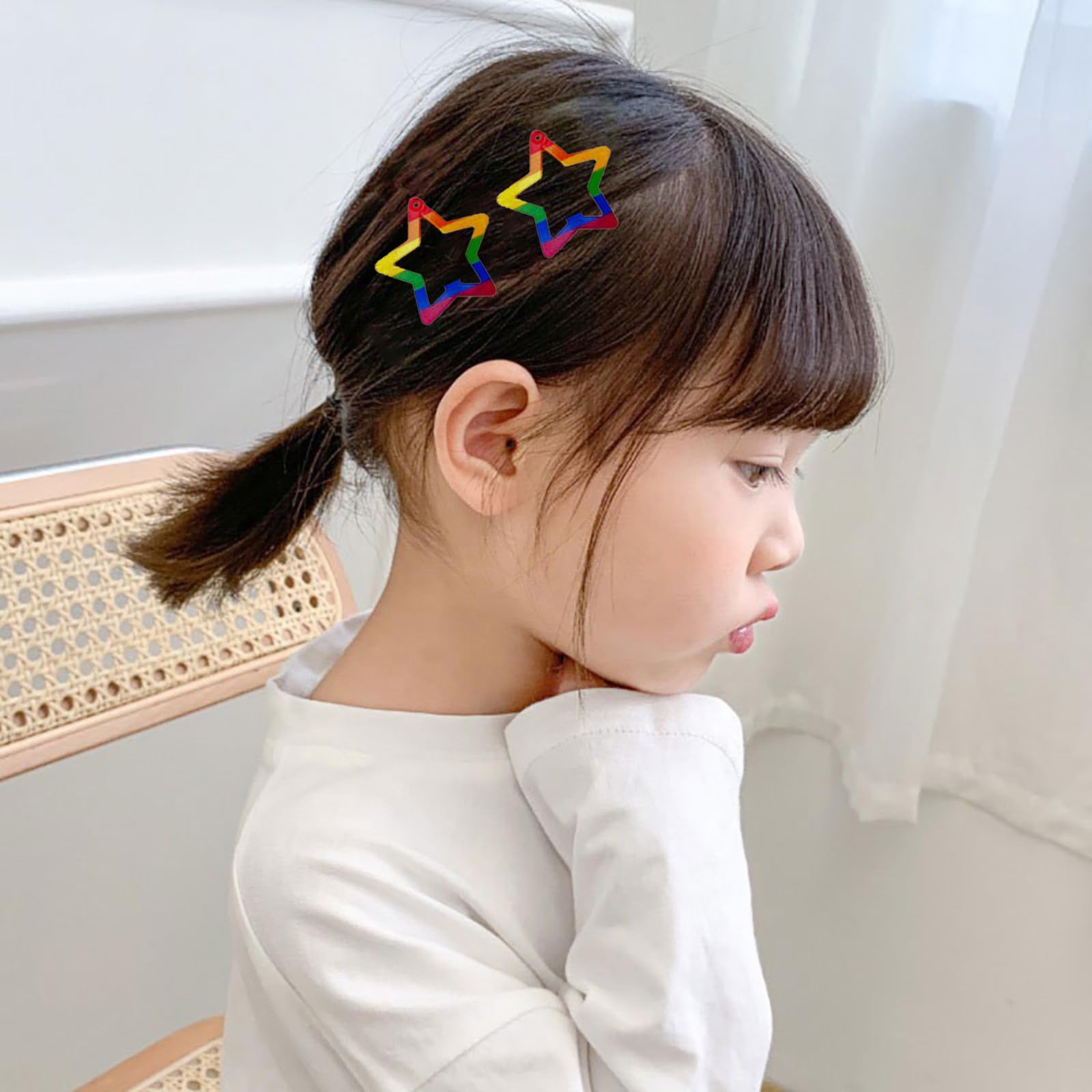 AIUPUOC clips worn in a half-up hairstyle showing bright pride accent